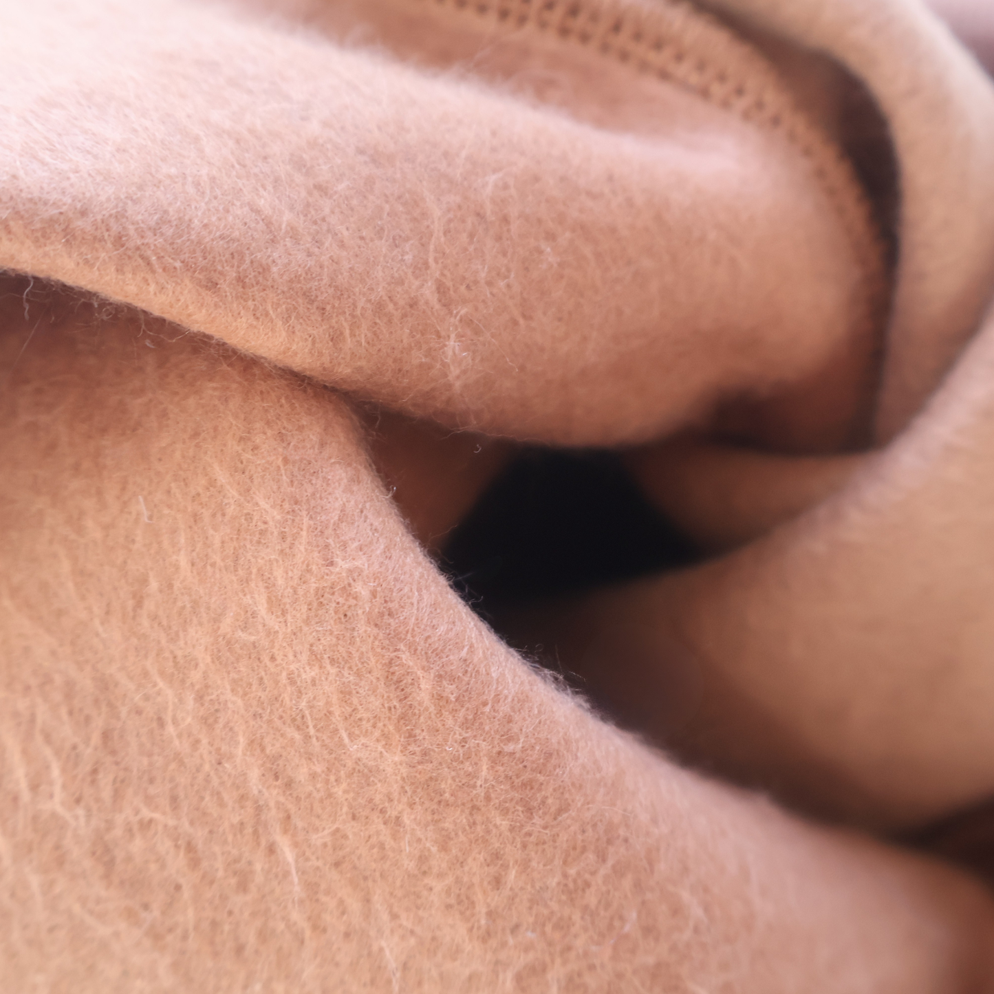 Close-up of brown fabric with an emphasis on texture
