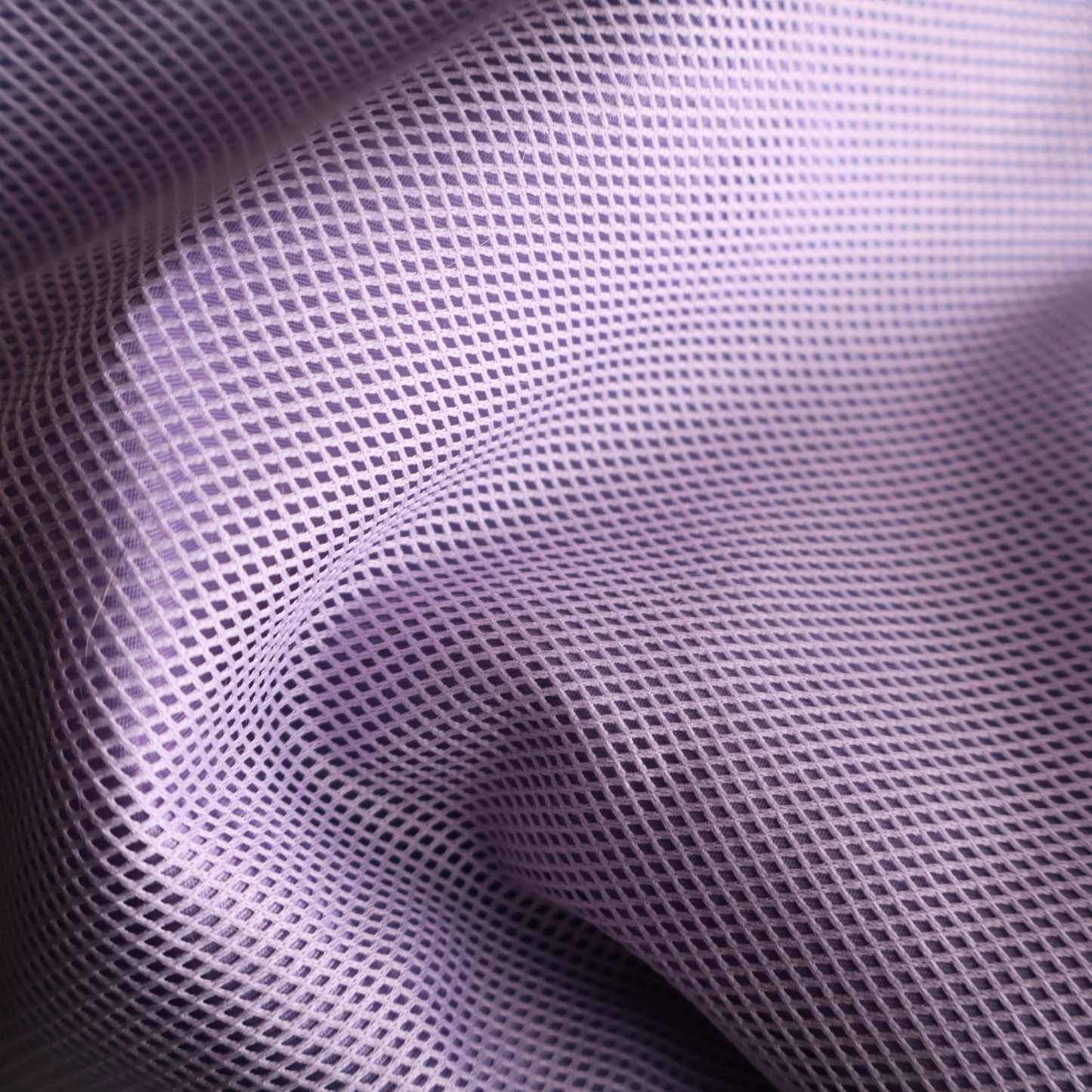 Close-up of purple mesh fabric with a grid pattern