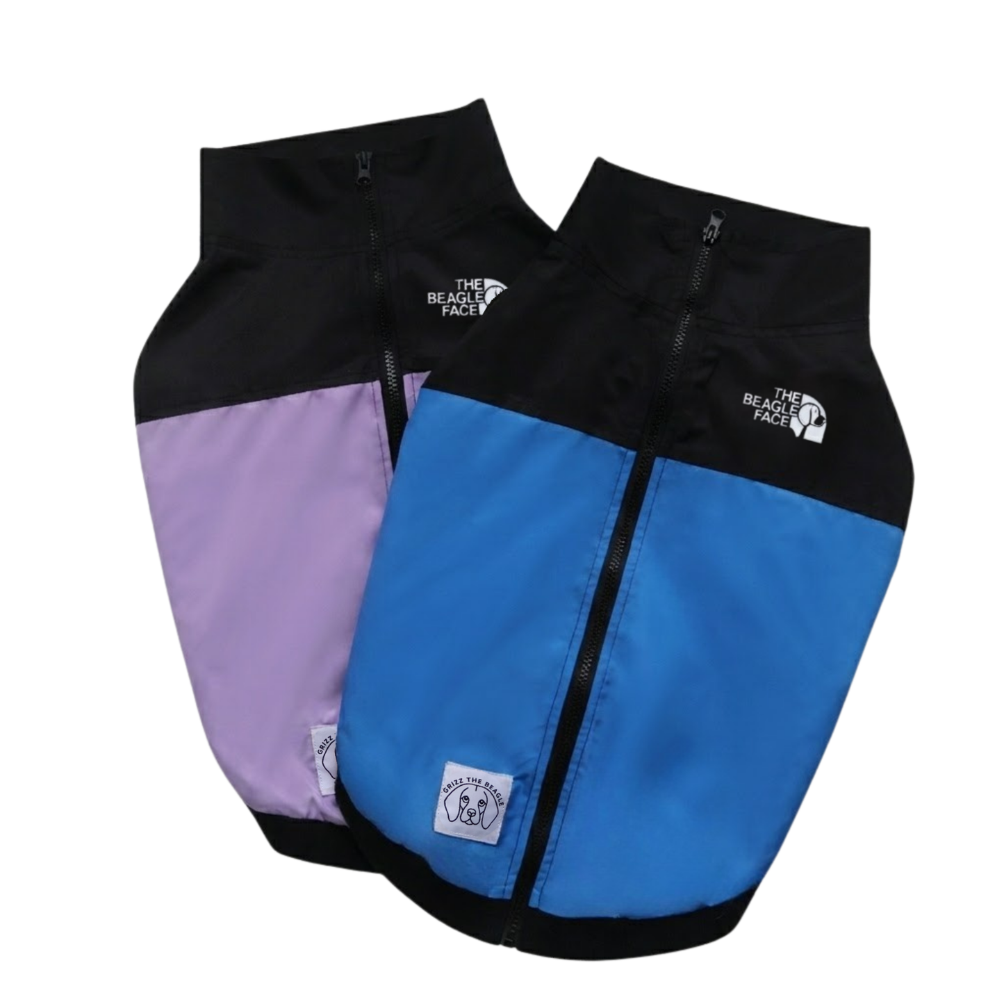 Two dog vests, one black with purple and one with blue, on a white background.